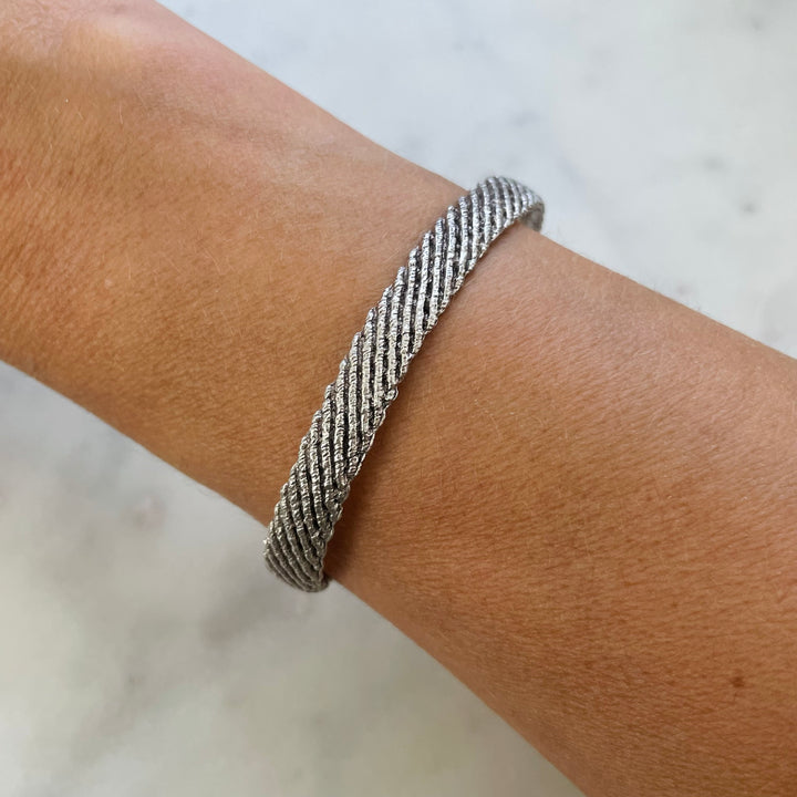 Woman Wears the MIMOSA Handcrafted Sterling Silver Friendship Bracelet Named Michelle