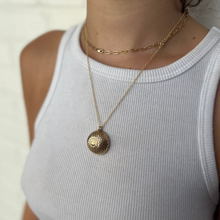 Woman Wearing Handcrafted Domed Planetarium Pendant Necklace