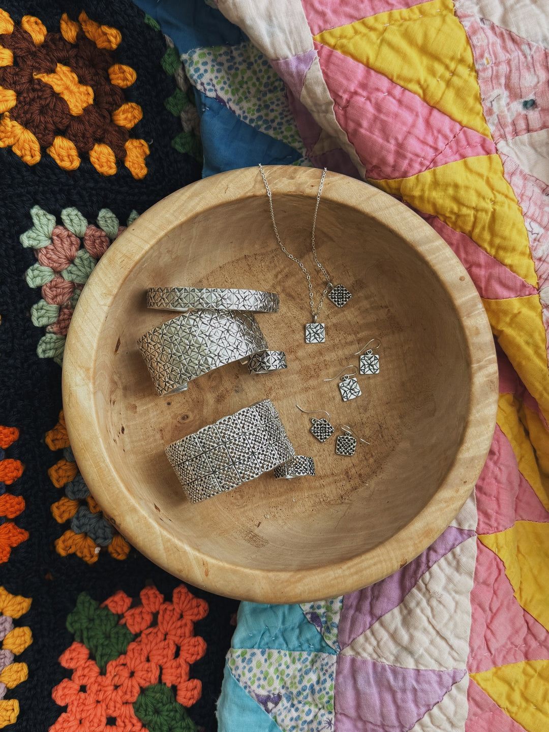 Handmade quilt square jewelry and granny square jewelry in silver