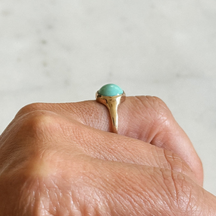 Person Wears Bronze Turquoise Gemstone Ring with Ten Millimeter Stone | MIMOSA Handcrafted
