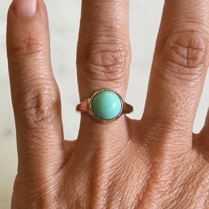 Person Wears Bronze Turquoise Gemstone Ring with Ten Millimeter Stone | MIMOSA Handcrafted