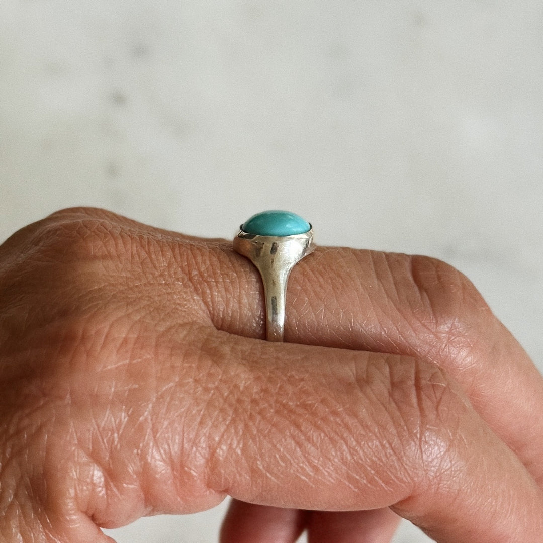 Person Wears Silver Turquoise Gemstone Ring with Ten Millimeter Stone | MIMOSA Handcrafted