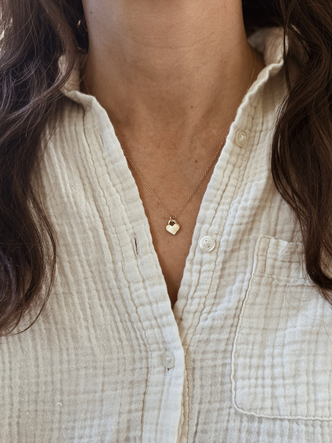 Woman Wears the MIMOSA Handcrafted 14K Gold Small Heart Pendant 