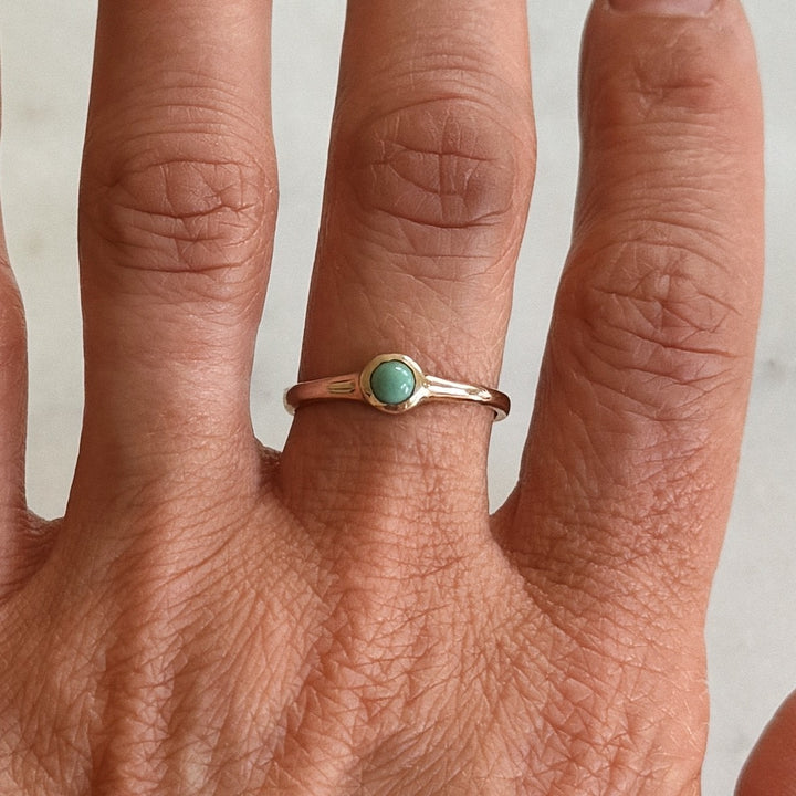 Person Wears Bronze Turquoise Gemstone Ring with Four Millimeter Stone | MIMOSA Handcrafted