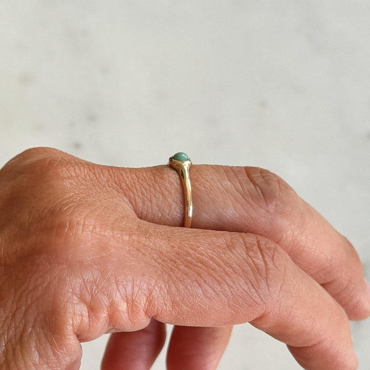 Person Wears Bronze Turquoise Gemstone Ring with Four Millimeter Stone | MIMOSA Handcrafted