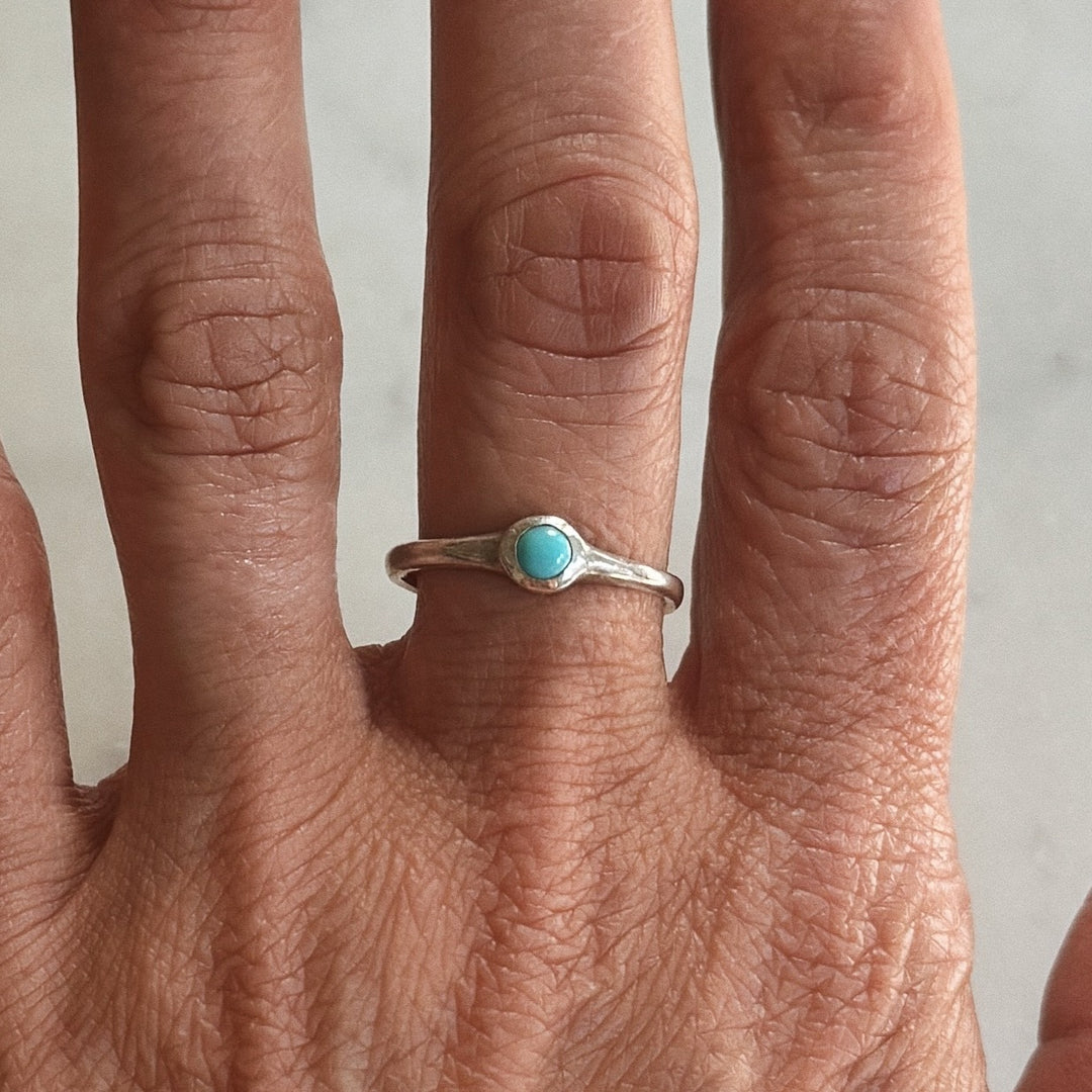 Person Wears Silver Turquoise Gemstone Ring with Four Millimeter Stone | MIMOSA Handcrafted