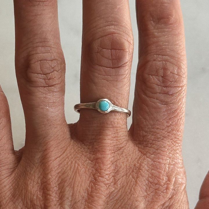 Person Wears Silver Turquoise Gemstone Ring with Four Millimeter Stone | MIMOSA Handcrafted
