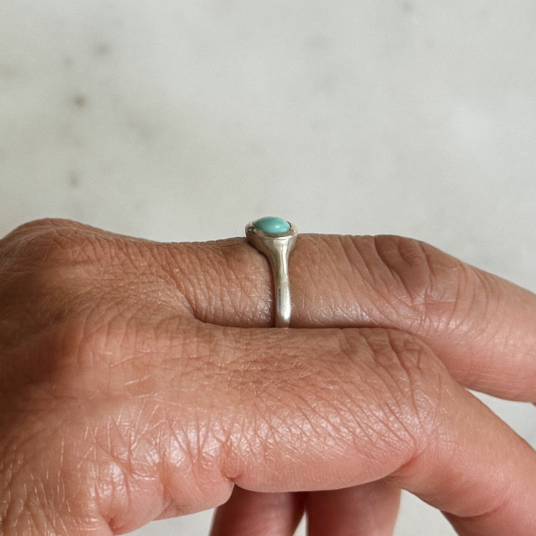 Person Wears Silver Turquoise Gemstone Ring with Six Millimeter Stone | MIMOSA Handcrafted