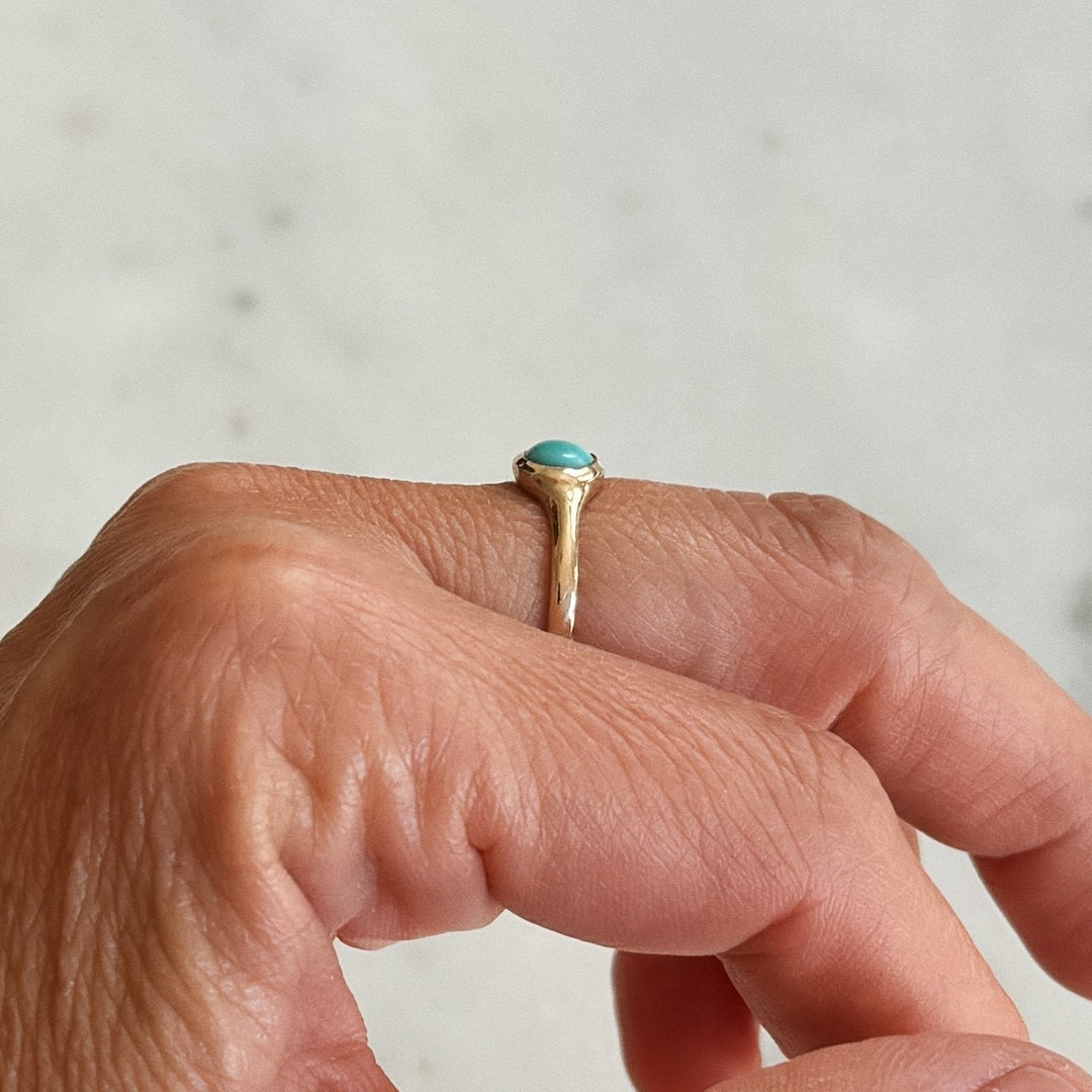 Person Wears Bronze Turquoise Gemstone Ring with Six Millimeter Stone | MIMOSA Handcrafted