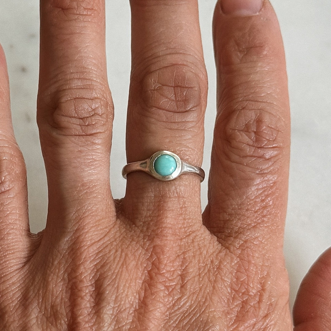 Person Wears Silver Turquoise Gemstone Ring with Six Millimeter Stone | MIMOSA Handcrafted