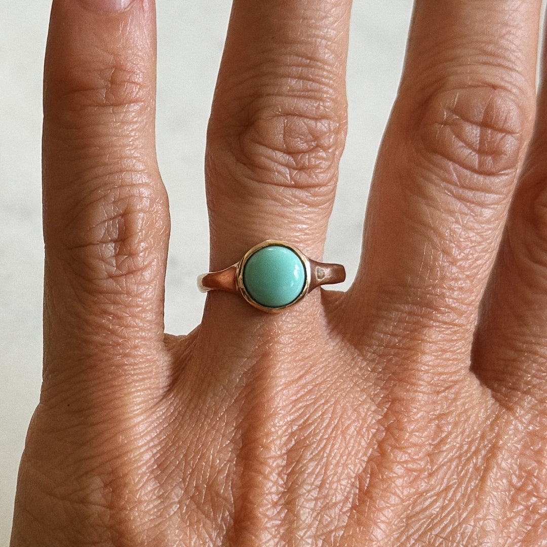 Person Wears Bronze Turquoise Gemstone Ring with Eight Millimeter Stone | MIMOSA Handcrafted