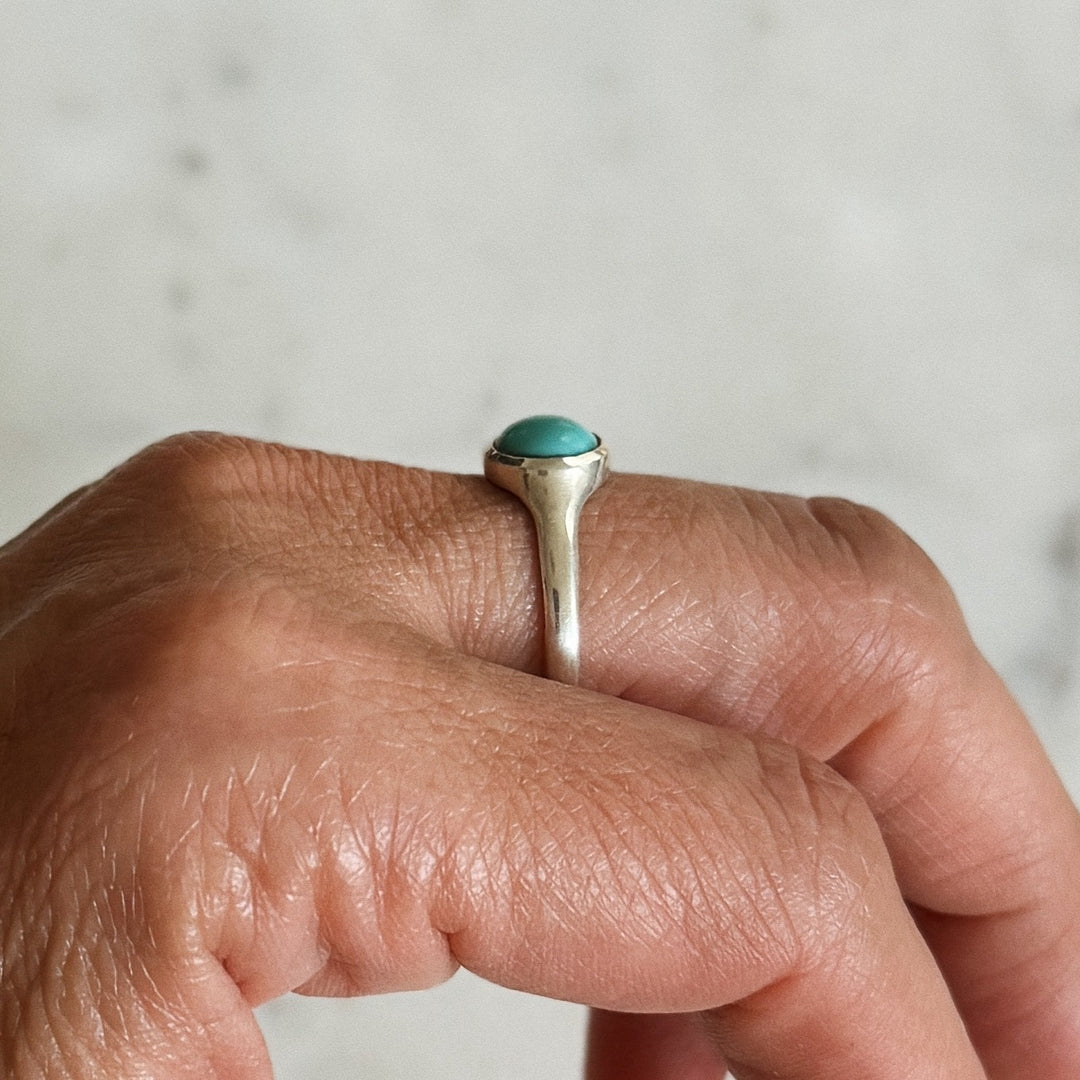Person Wears Silver Turquoise Gemstone Ring with Eight Millimeter Stone | MIMOSA Handcrafted