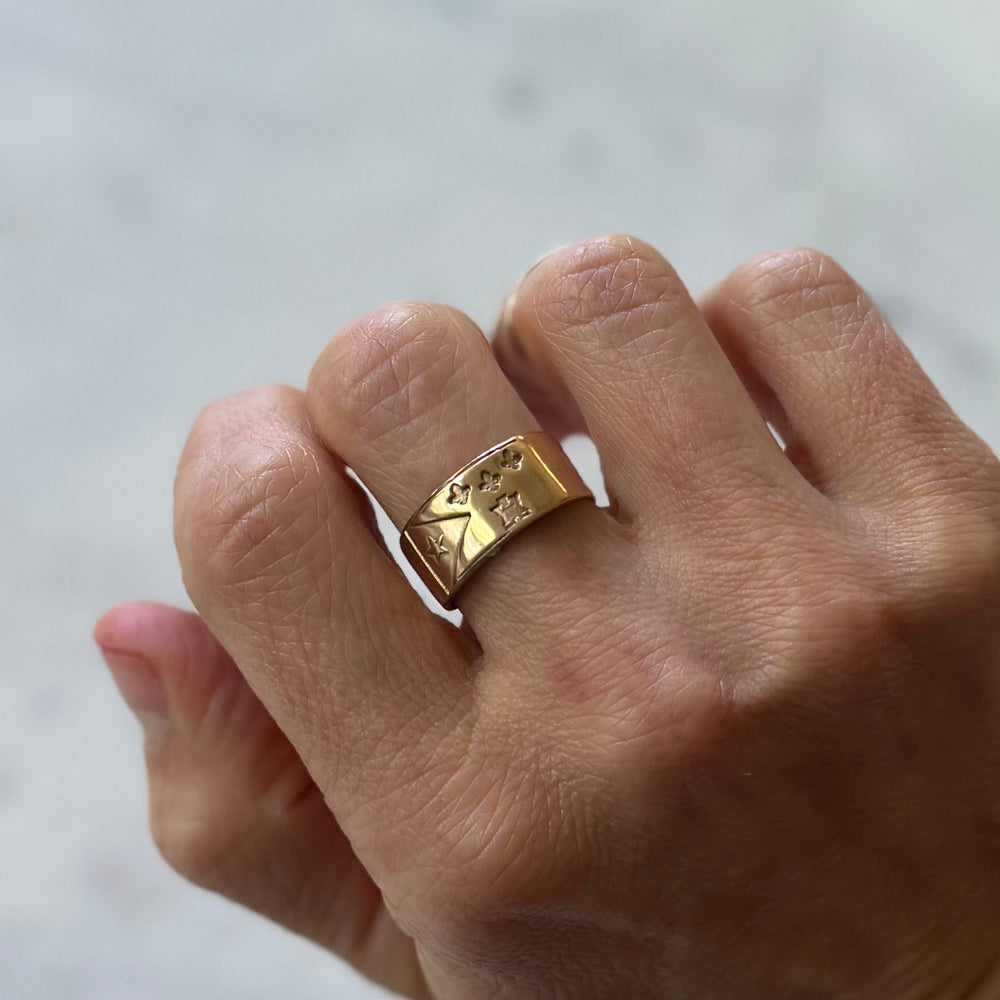 Person wears Bronze Acadian Flag Ring with Adjustable Band 