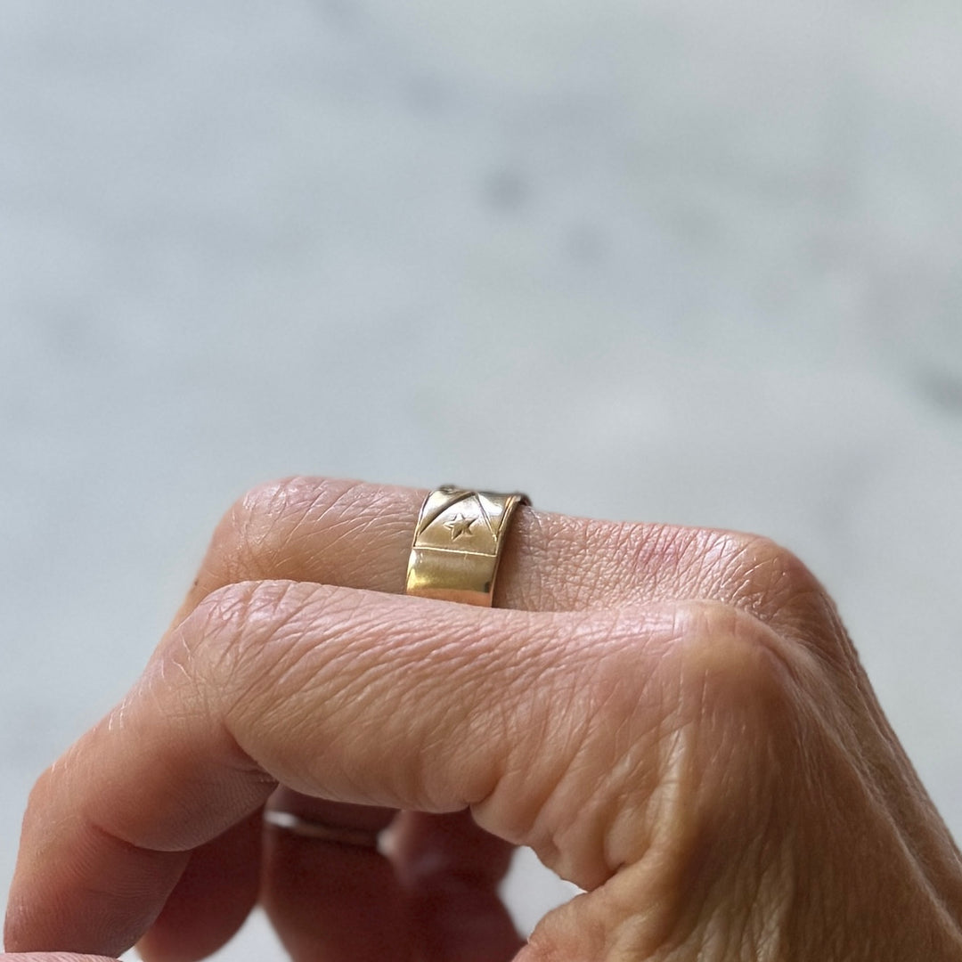 Person wears Bronze Acadian Flag Ring with Adjustable Band 