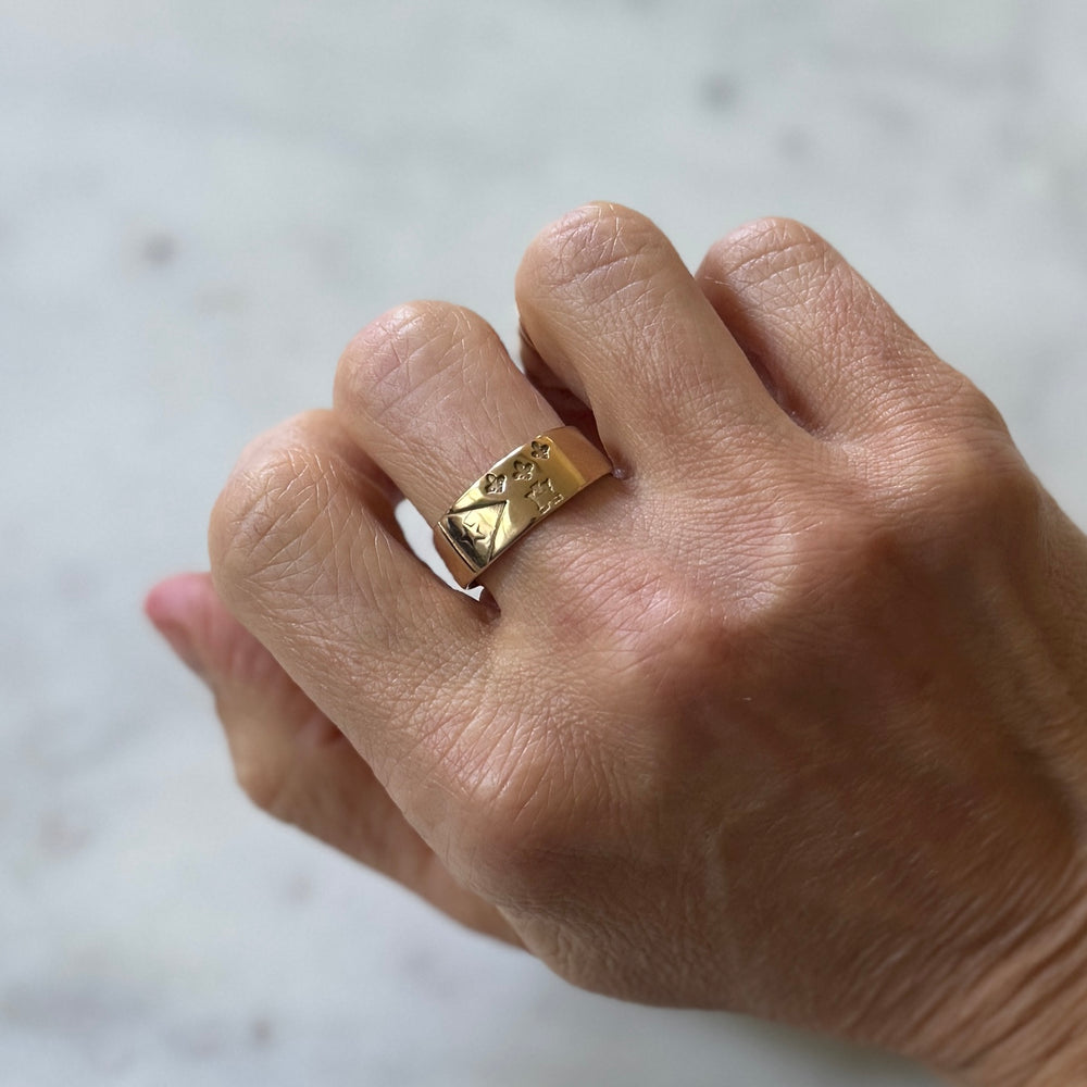 Person wears Bronze Acadian Flag Ring from MIMOSA Handcrafted
