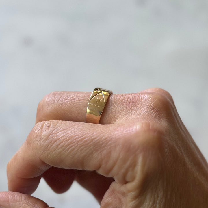 Person wears Bronze Acadian Flag Ring from MIMOSA Handcrafted
