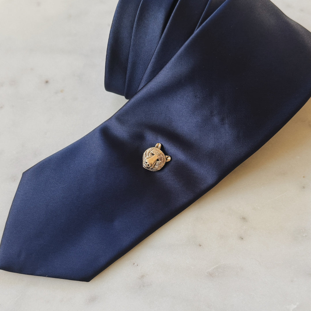 Bronze Bear Head Pin on Navy Blue Tie
