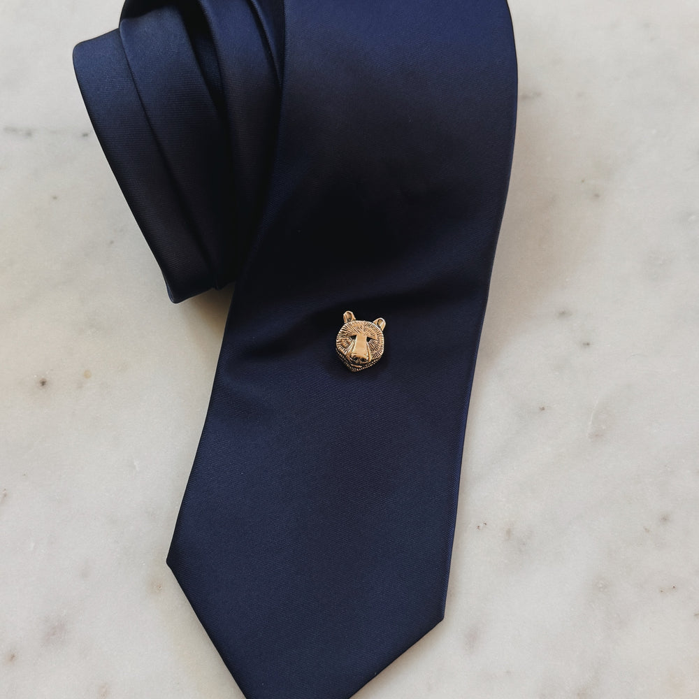 Bronze Bear Head Pin on a Navy Blue Tie