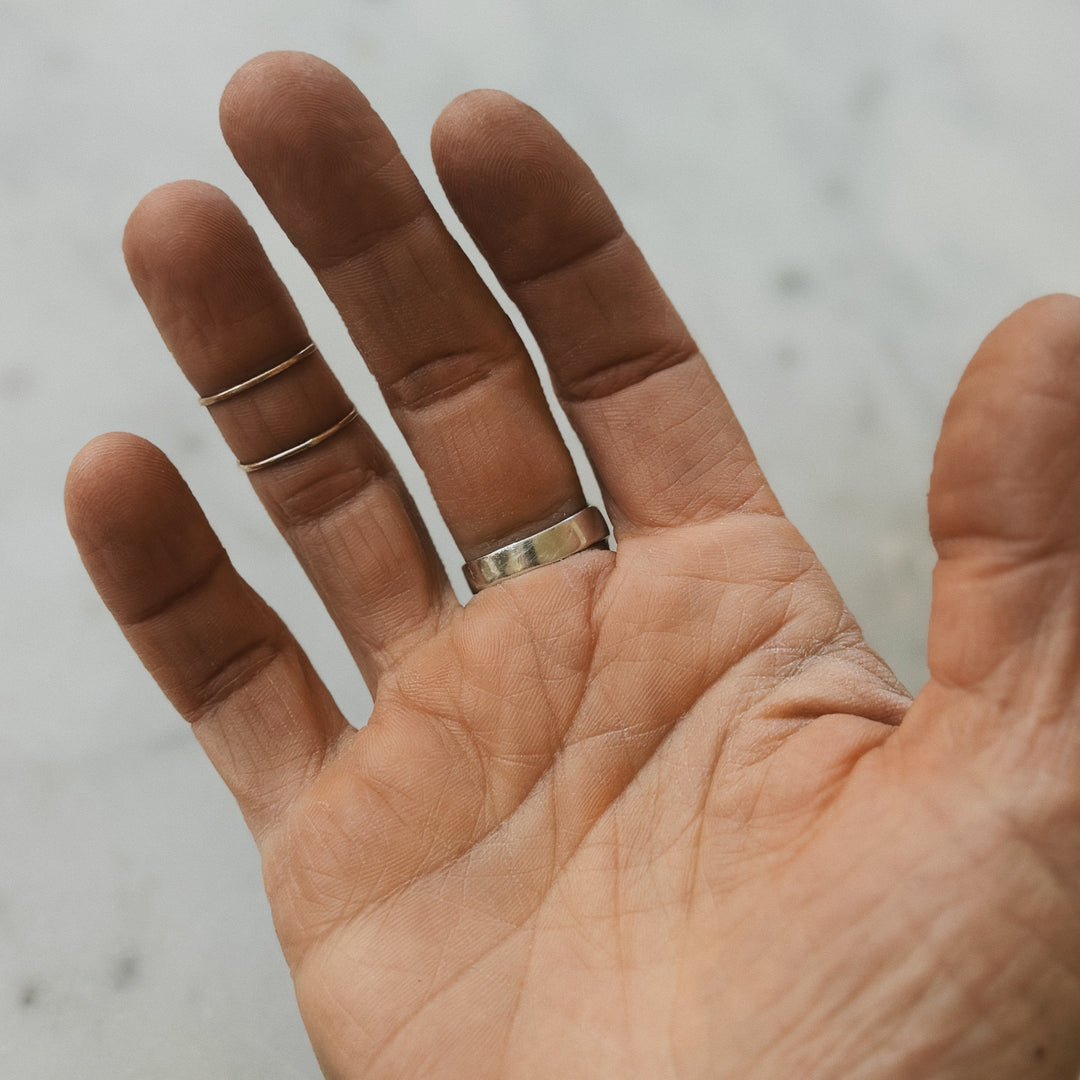 Hand Wearing Sterling Silver Ring Band