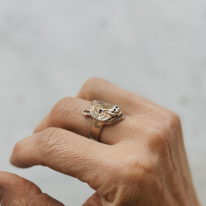 Hand Wearing a Bear Head Ring in Bronze