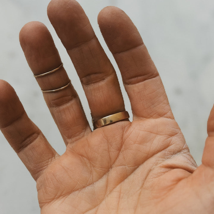 Hand Wearing Bronze Ring Band