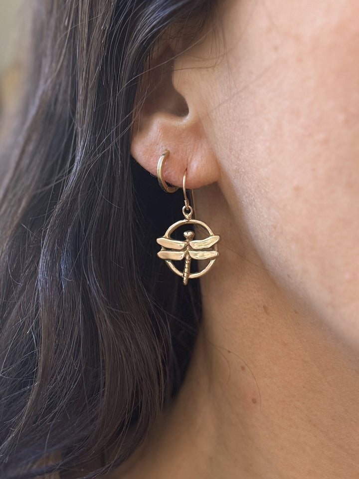 Woman Wears Dragonfly Earrings in Bronze