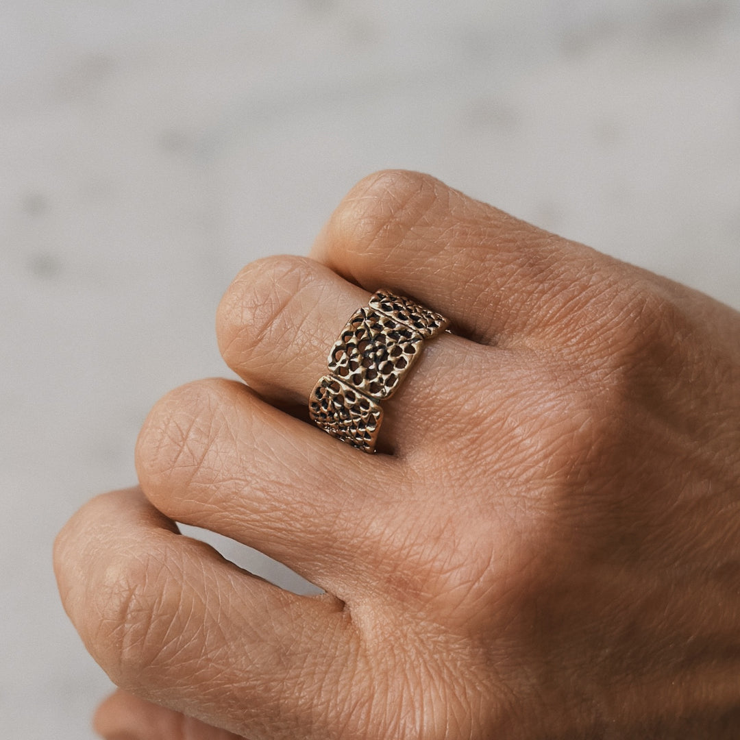 Person wears a handmade granny square ring in bronze by MIMOSA Handcrafted