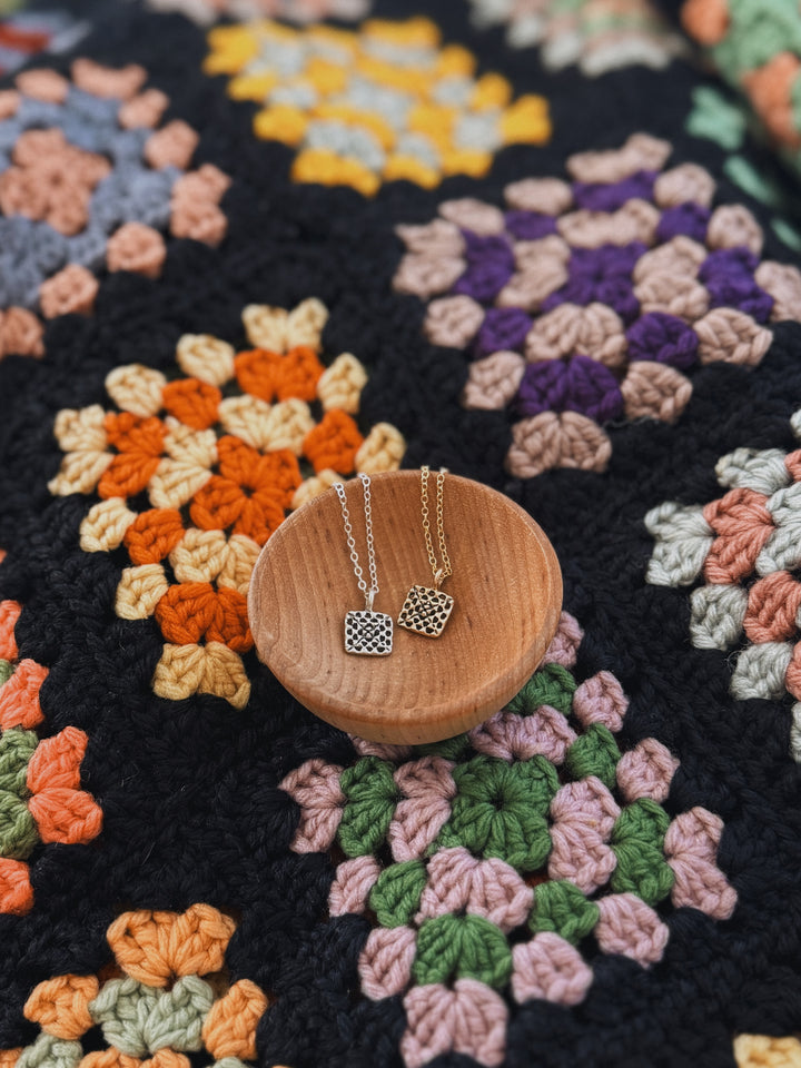 Handmade granny square necklaces in silver and bronze