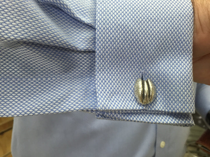 Man Wears MIMOSA Handcrafted Pecan Cufflinks in Sterling Silver