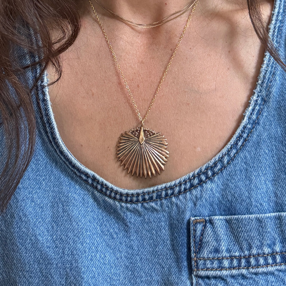 Person wears a Large Bronze Palmetto Necklace from MIMOSA Handcrafted