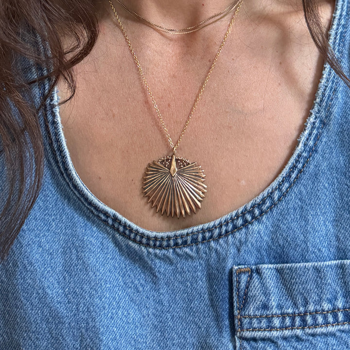 Person wears a Large Bronze Palmetto Necklace from MIMOSA Handcrafted