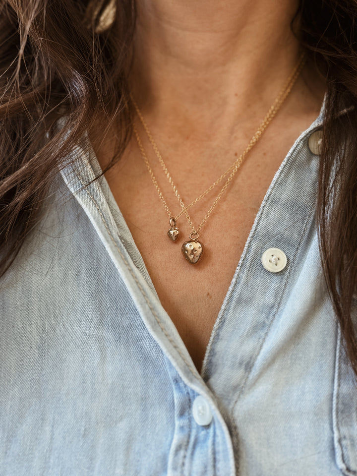 Woman Wears the MIMOSA Handcrafted Large and Small Strawberry Pendants in Bronze