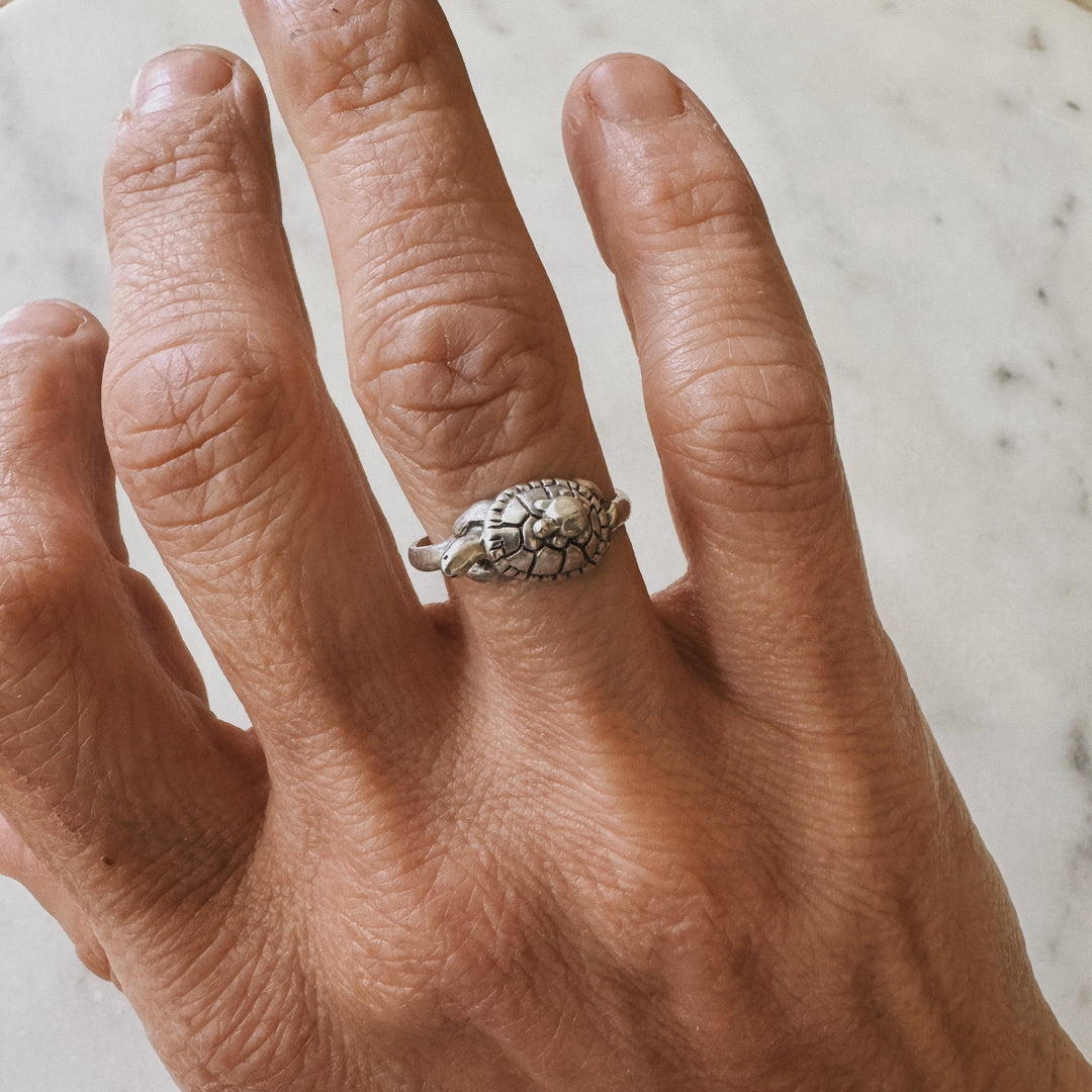 Hand wearing a Mom and Baby Turtle Ring from MIMOSA Handcrafted in sterling silver