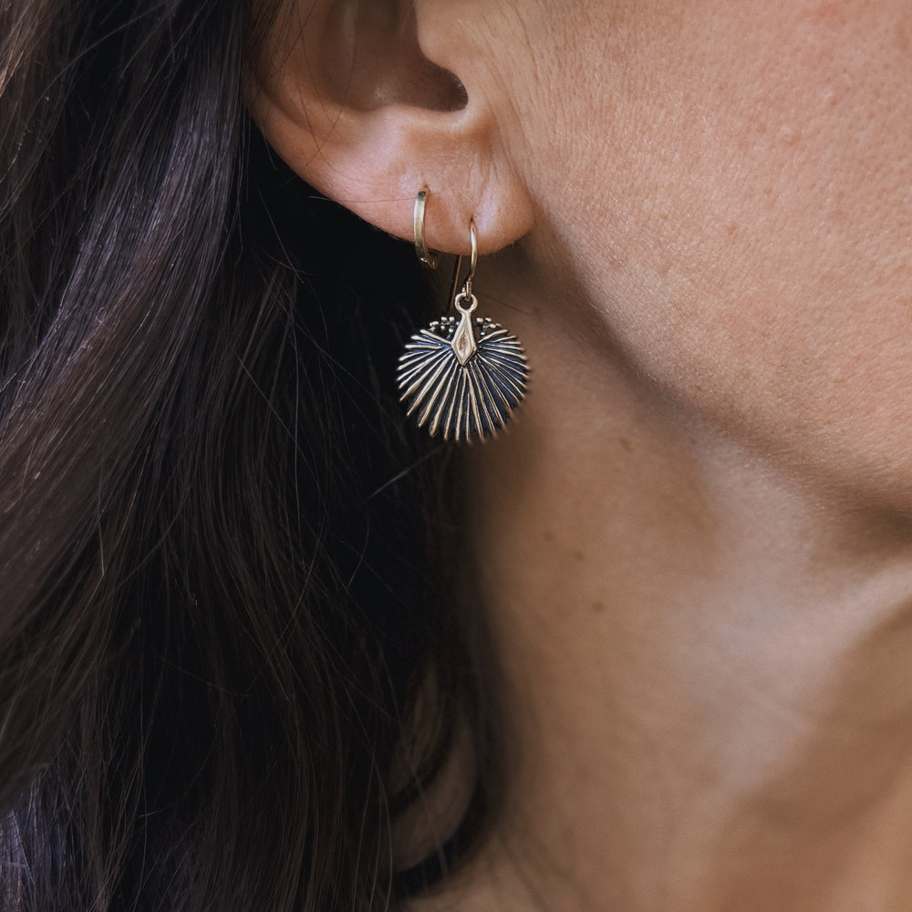 Woman Wears Small Palmetto Leaf Earrings in Bronze | MIMOSA Handcrafted