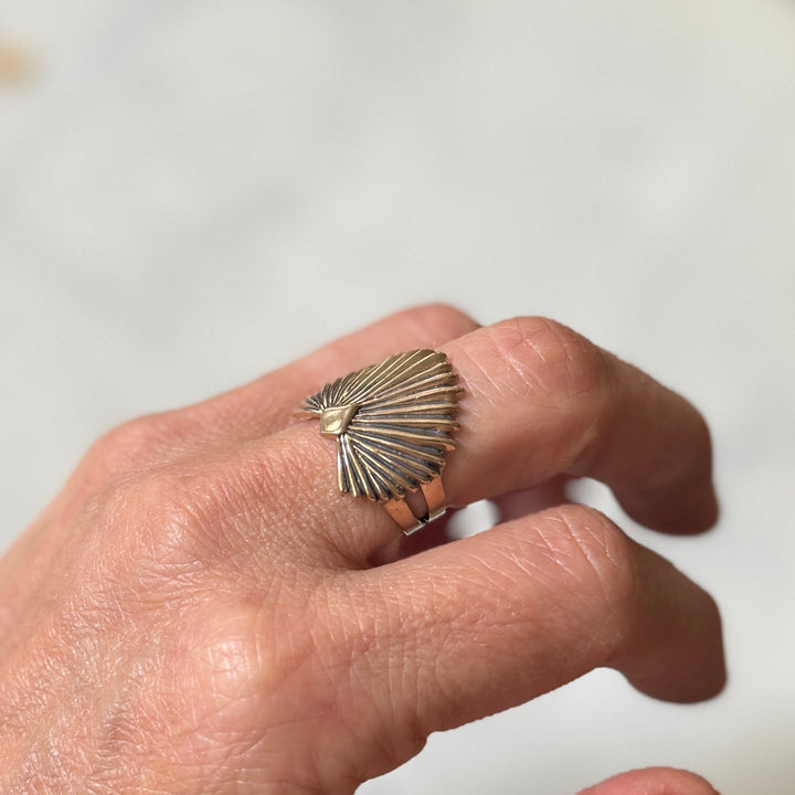 Person wears a Bronze Palmetto Ring from MIMOSA Handcrafted