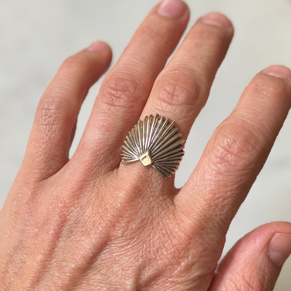 Person wears a Bronze Palmetto Ring from MIMOSA Handcrafted