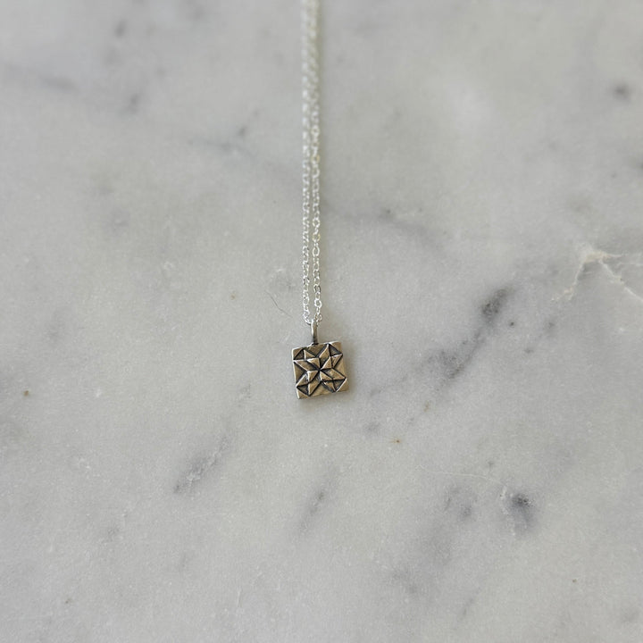 Handmade quilt square necklace in sterling silver by MIMOSA Handcrafted