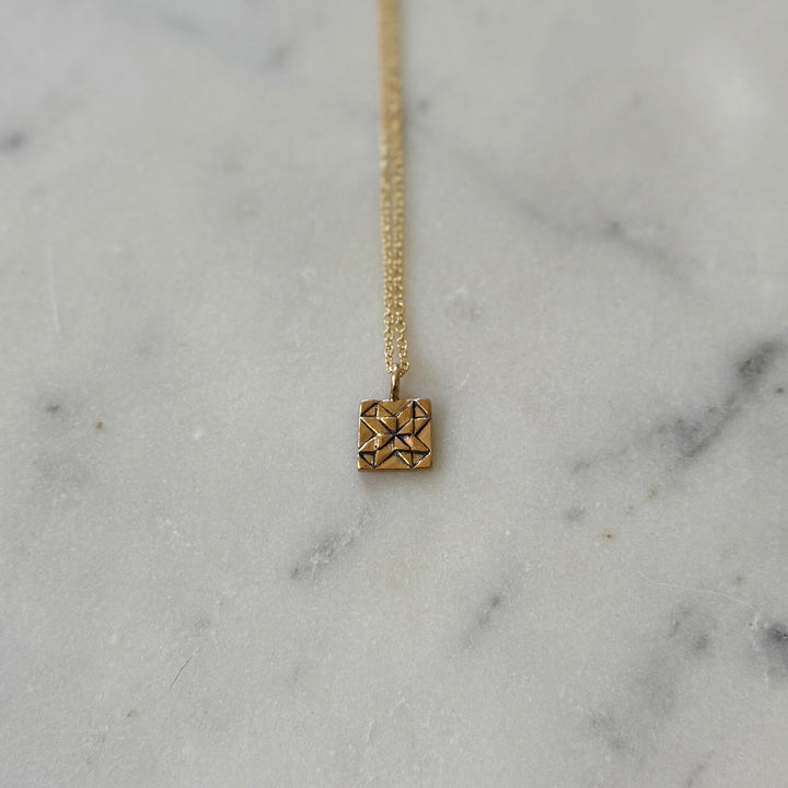Handmade quilt square necklace in bronze by MIMOSA Handcrafted