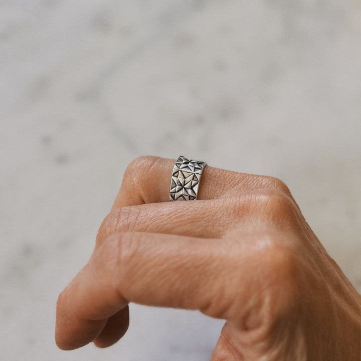 Person wears a handmade quilt square ring in sterling silver by MIMOSA Handcrafted