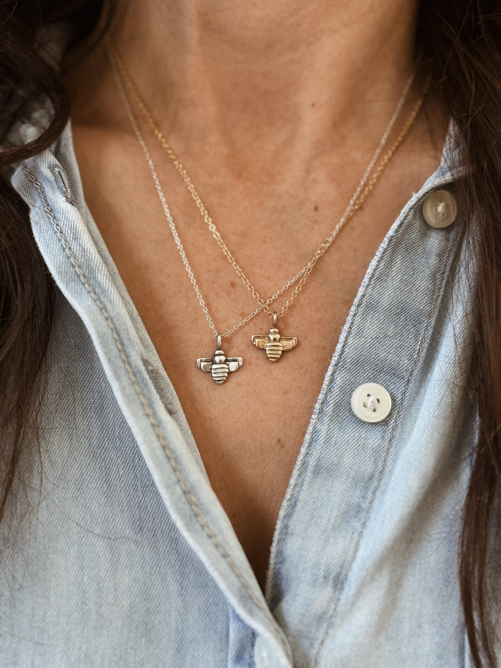 Woman Wears the MIMOSA Handcrafted Small Bee Pendants in Bronze and Sterling Silver