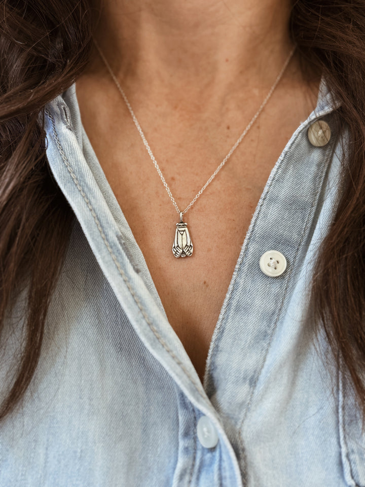 Woman Wears the MIMOSA Handcrafted Small Cicada Pendant in Sterling Silver