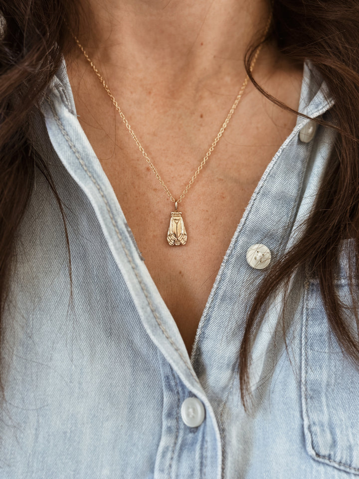 Woman Wears the MIMOSA Handcrafted Small Cicada Pendant in Bronze