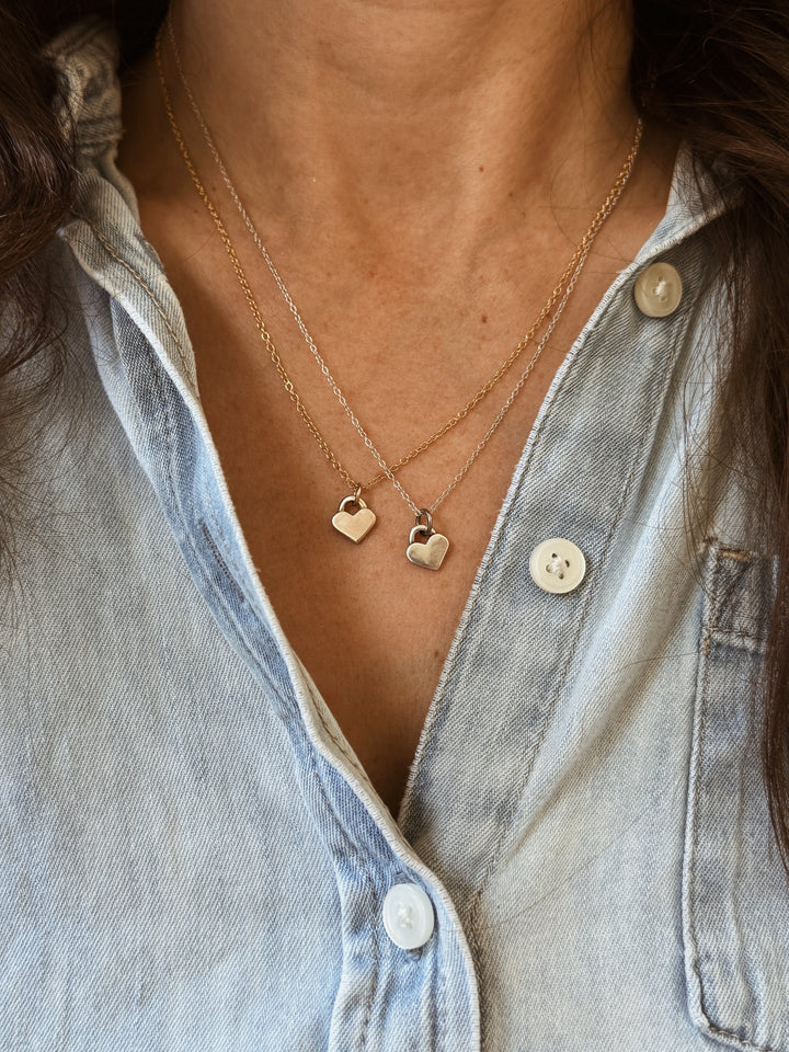 Woman Wears the MIMOSA Handcrafted Small Heart Pendants in Bronze and Sterling Silver