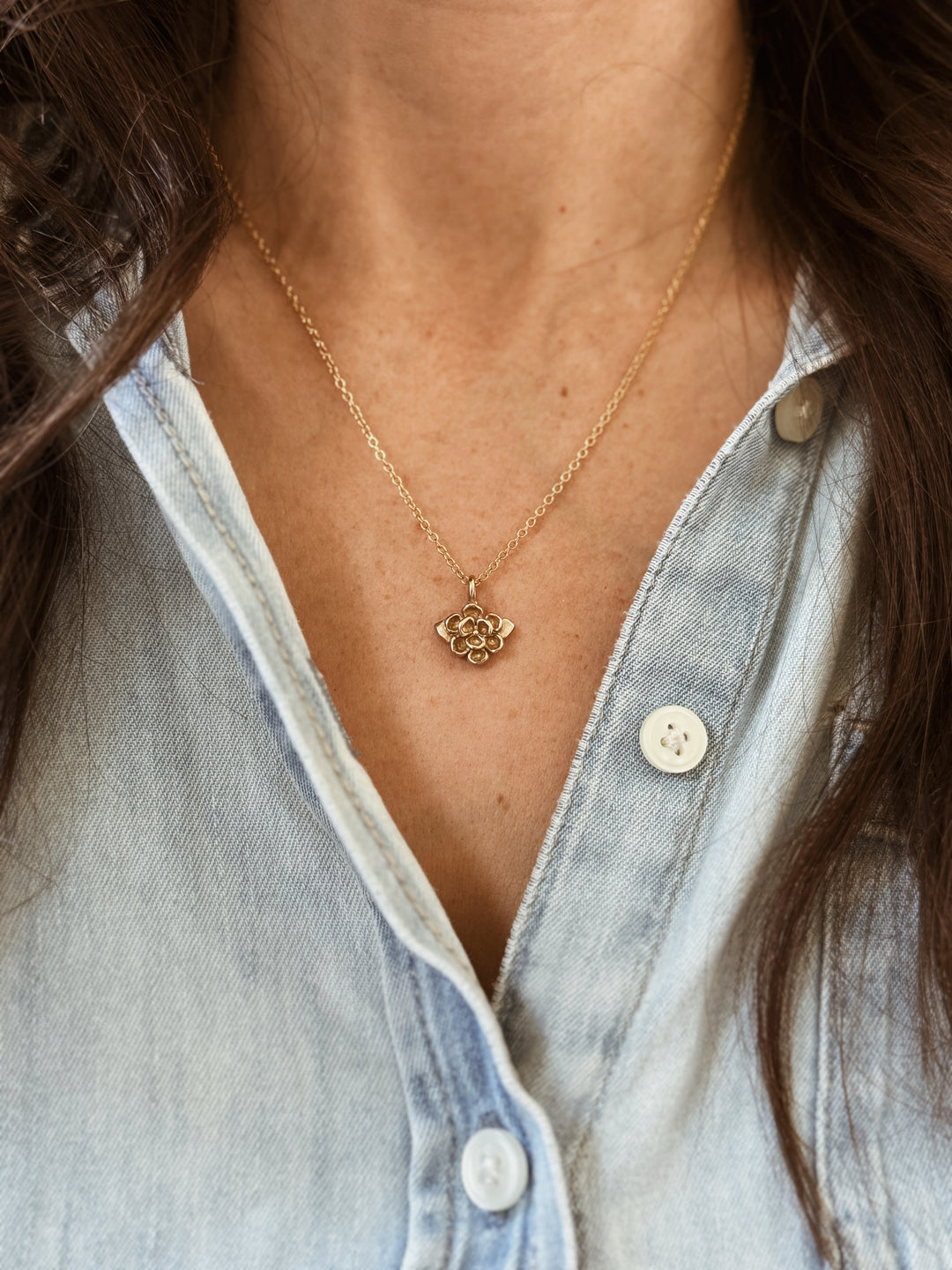 Woman Wears the MIMOSA Handcrafted Small Magnolia Flower Pendant in Bronze