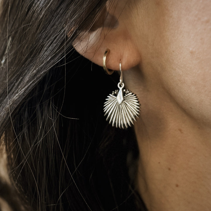 Person Wears Sterling Silver Palmetto Leaf Earrings on Silver Ear Wires