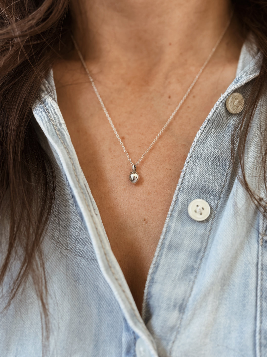 Woman Wears the MIMOSA Handcrafted Small Strawberry Pendant in Sterling Silver