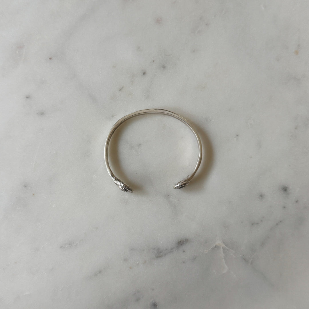 Sterling Silver Bracelet on Marble Surface