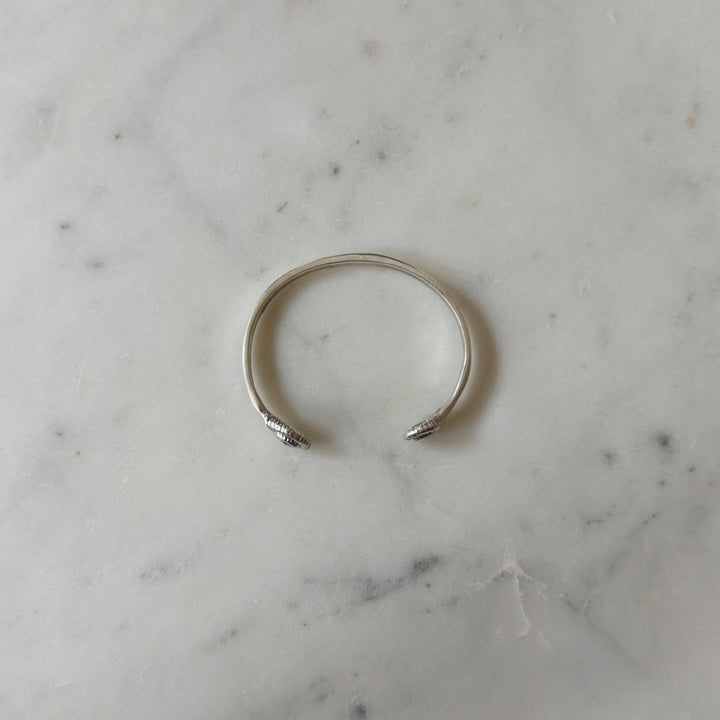 Sterling Silver Bracelet on Marble Surface