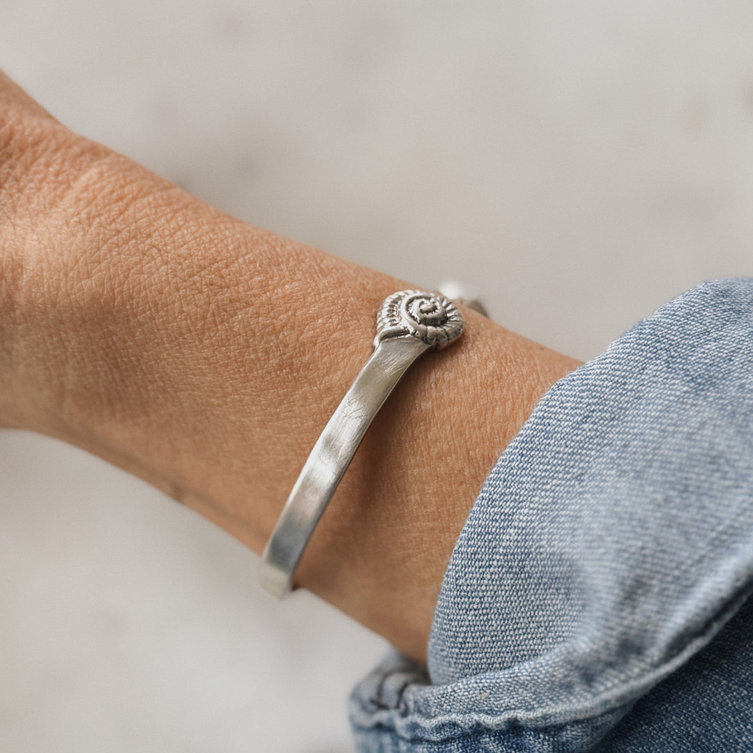 Sterling Silver Bracelet with Spiral Snail Shell Design on a Wrist