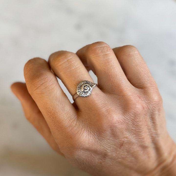 Person Wears Sterling Silver Snail Shell Ring on Middle Finger